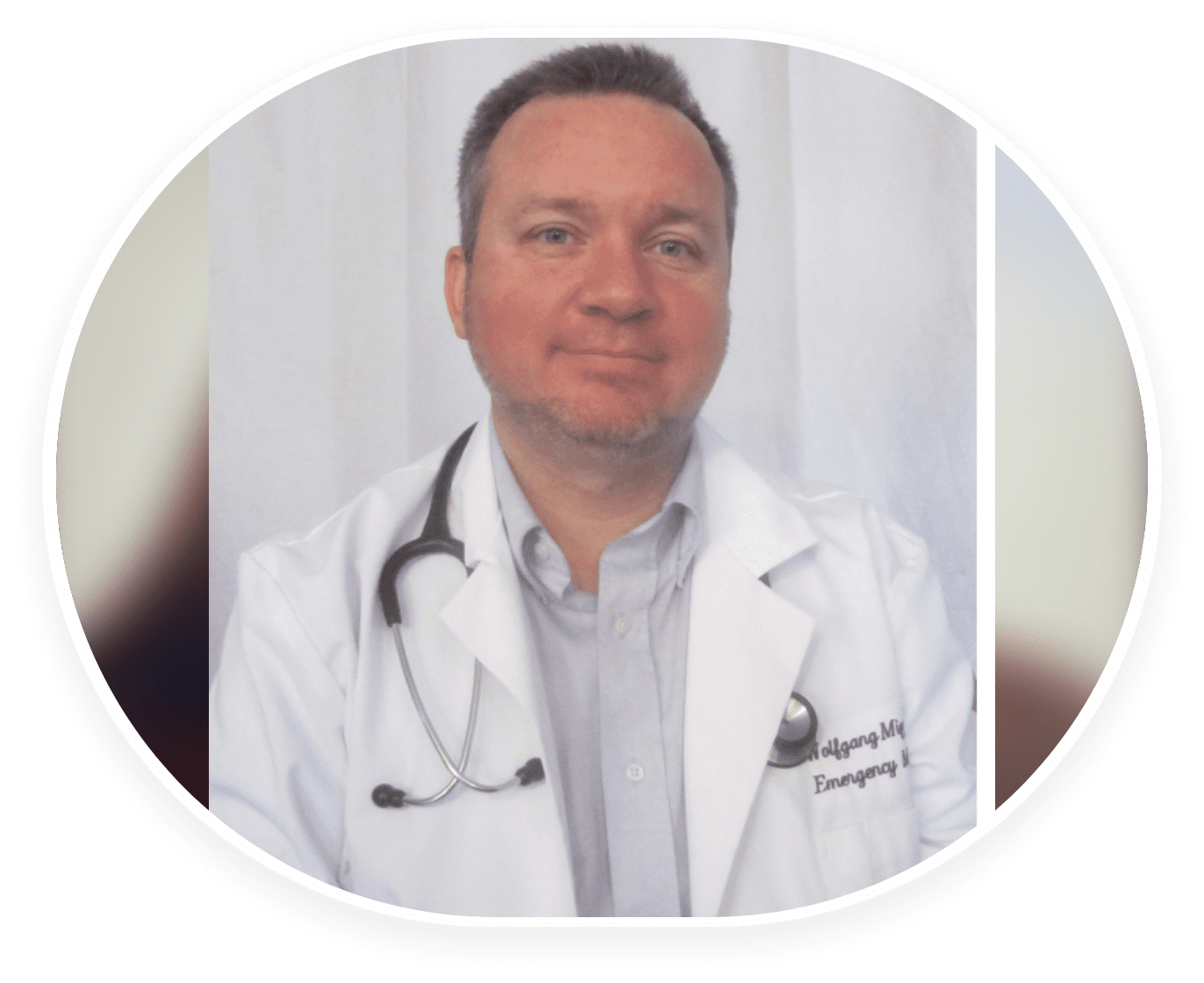Portrait of a male doctor in white coat with stethoscope.
